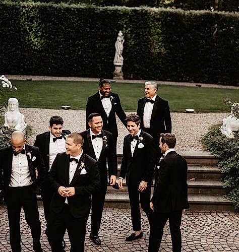 Group of men in wedding suits