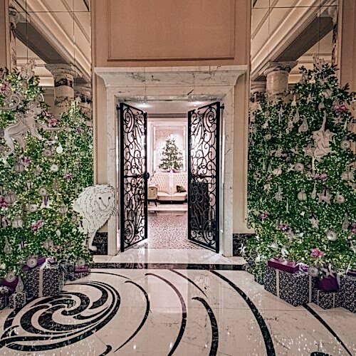 Entrance to Langham London Hotel with Christmas trees