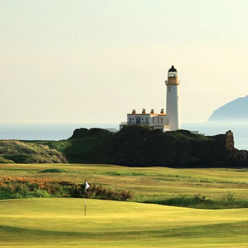 View a golf course, lighthouse and the sea